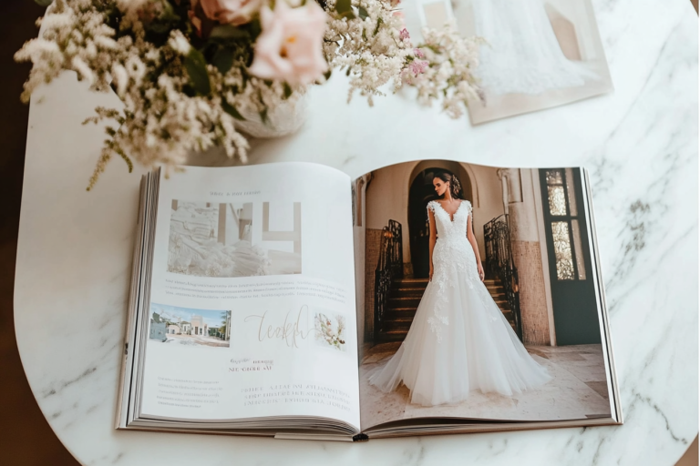 An open bridal magazine showcasing traditional advertising methods, highlighting the comparison with modern digital marketing strategies